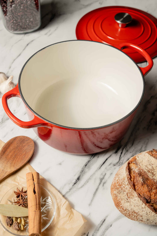 5.3L Enamel Coated Cast Iron Pot Open on Table with Lid, showing inner enamel.